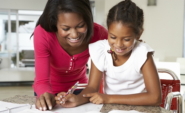 Mother Helping Daughter With Homework